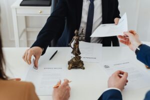 Lawyer pointing out mistake on life insurance beneficiary form